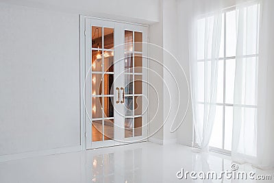 Empty white room with big window and glass french door with bright orange lights Stock Photo