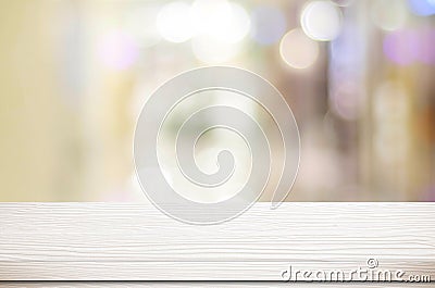 Empty white table and blurred store bokeh background, product di Stock Photo