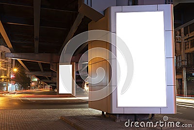 An empty white vertical light box installed under the expressway Stock Photo