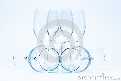 Empty wine glasses stand and lie symmetrically Stock Photo