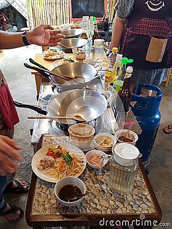 Empty wok big spoon wood plate ingridients pulver instruction cooking class thai food course chiang mai thailand water Editorial Stock Photo