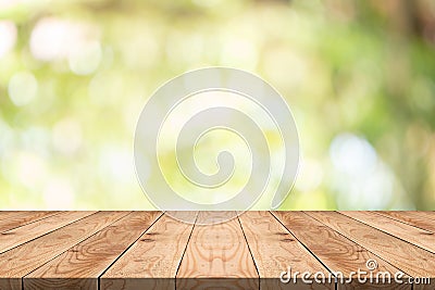 Empty wood table on blurred background copy space for montage your product or design,Blank brown board with abstract blurred Stock Photo