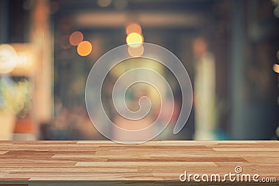 Empty wood table and Blurred background display at coffee shop Stock Photo