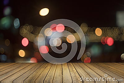 Empty wood table and blurred bokeh out of focus in night light background. product display template. Business presentation Stock Photo