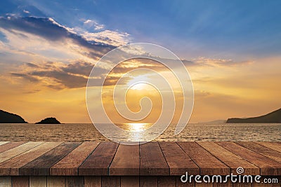Empty wood table and landscape of sunset on the coast sea, waves with display montage for product Stock Photo