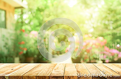 Empty wood table top on blur abstract green from garden Stock Photo