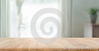 Empty wood table top on blur abstract home room,window view Stock Photo