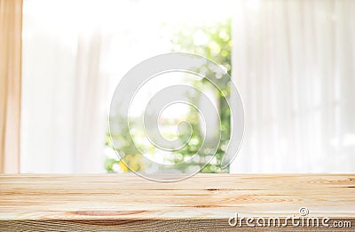 Empty of wood table top on blur of curtain window and garden Stock Photo