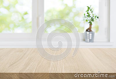 Empty wood table top and blur window interior abstract background Stock Photo