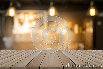 Empty wood table top on blurred background form coffee shop Stock Photo