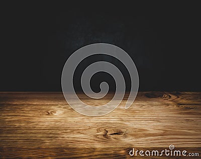 Empty wood table top counter on dark wall background Stock Photo