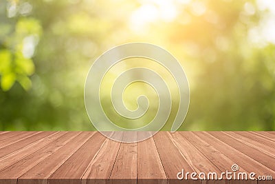 Empty wood table top on nature green blurred background at garden,space for montage show products Stock Photo