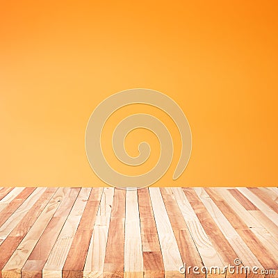 Empty of wood table top on orange pastel color background Stock Photo