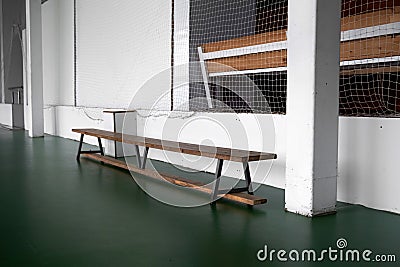 Empty wooden benche in school. Tribune in the gym for fans of matches with empty wooden seats. Lifestyle, game and power Stock Photo