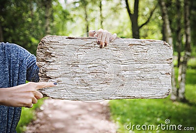 Empty wooden board hold by woman hand. Template mock up Stock Photo