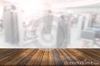 Empty wooden board space platform with blur fitness gym equipment background Stock Photo
