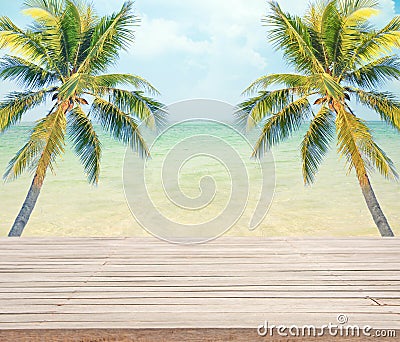 Empty wooden with coconut tree and sea background for product display. Stock Photo