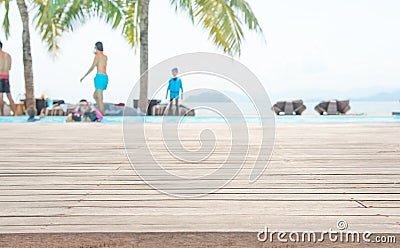 Empty wooden with coconut tree and sea background for product display. Stock Photo