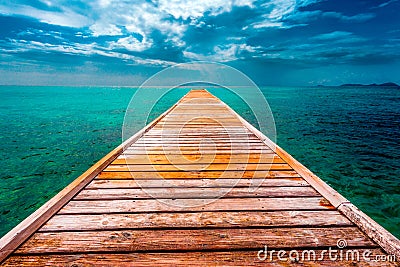 Empty Wooden Dock Over Tropical Blue Water Stock Photo