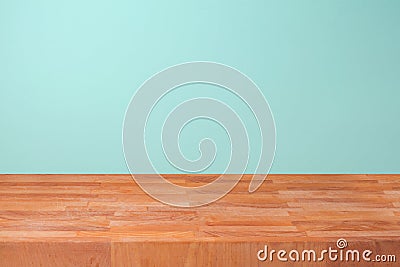 Empty wooden kitchen counter over mint wall background for product montage Stock Photo