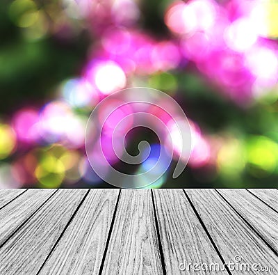Empty Wooden Perspective Platform with Sparkling Abstract Rainbow Blur Bokeh used as Template to Mock up for Display Product Stock Photo