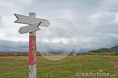 Empty wooden road pointer Stock Photo