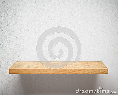 Empty wooden shelf or bookshelf on white wall Stock Photo