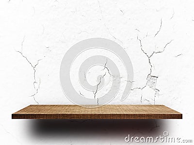 Empty wooden shelf on crack concrete wall for display Stock Photo