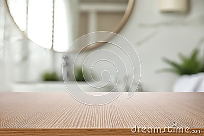 Empty wooden table and blurred view of bathroom interior Stock Photo