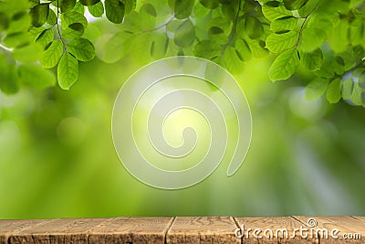 Empty wooden table with bokeh background and sun light for text ,Template mock up and display of product. green nature and ecology Stock Photo