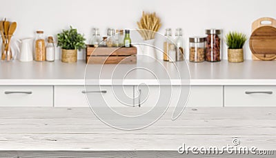 Empty wooden table with bokeh image of kitchen bench interior Stock Photo