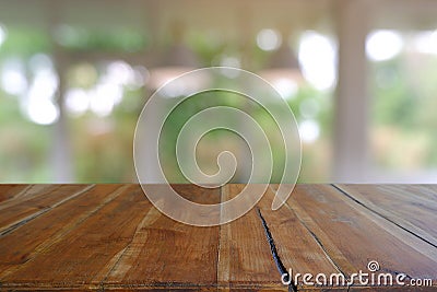 Empty wooden table in front of abstract blurred Cafe, restaurant at night. For montage product display or design key visual layout Stock Photo