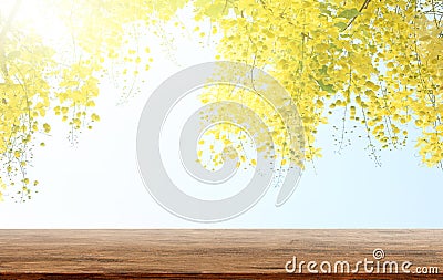 Empty wooden table with Golden shower or Cassia fistula is a background Stock Photo