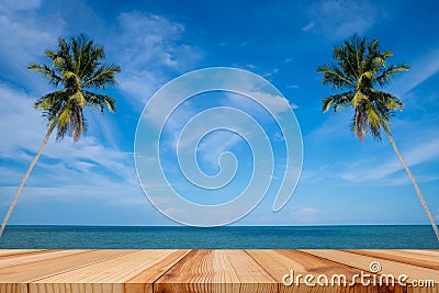 Empty wooden table and palm leaves with party on beach background in summer time, Tropical palm on a paradise island Stock Photo