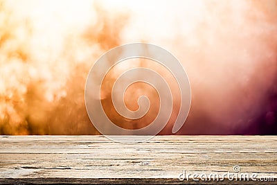 Empty wooden table for present product on bokeh background. Stock Photo