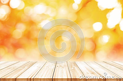 Empty wooden table top with blurred autumn abstract background. Stock Photo