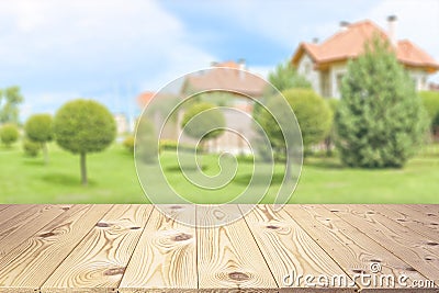 Empty wooden table top on blurred country house background mock up for design and product display Stock Photo