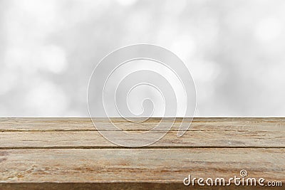 Empty wooden table top with blurred whitebackground. Can be used for display or montage your products Stock Photo