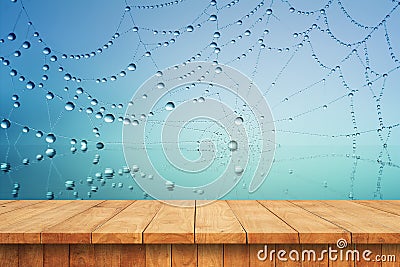 Empty wooden table and web spider water drop Stock Photo