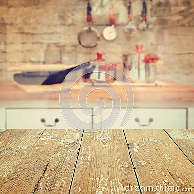 Empty wooden vintage table over kitchen blurred background Stock Photo