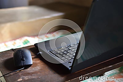 Empty workplace with computer wireless mouse lying with notebook pc on table Stock Photo