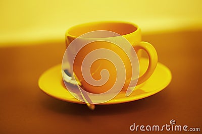 Empty yellow coffee cup Stock Photo