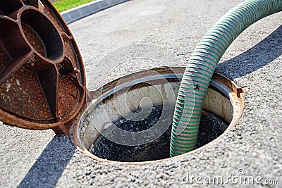 Emptying septic tank, cleaning the sewers Stock Photo