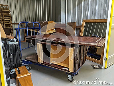 Emptying a self storage unit for a furniture removal clearance Stock Photo