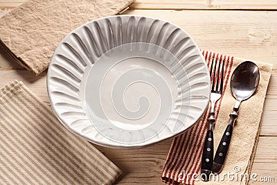Empy white shell design bowl with cutlery Stock Photo