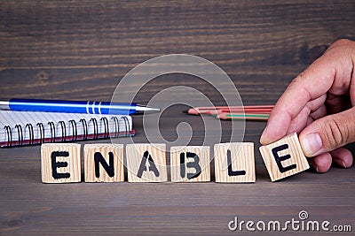 Enable. Wooden letters on dark background Stock Photo