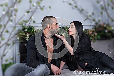 Enamored international couple look at each other Stock Photo