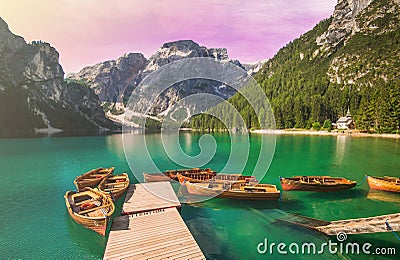 Enchanted view of Braies lake Pragser Wildsee at sunset in Alto Adige Stock Photo