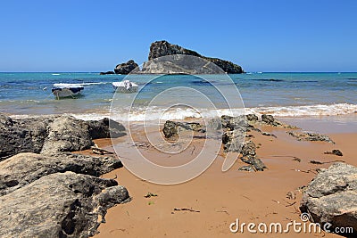 Enchanting landscape between the blue of the sea and the rocks Stock Photo