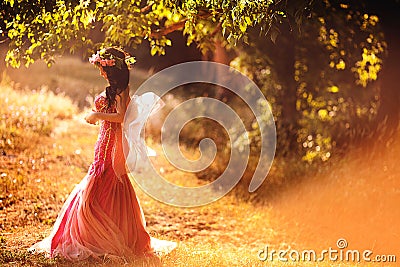 Enchanting Nymph in forest Stock Photo